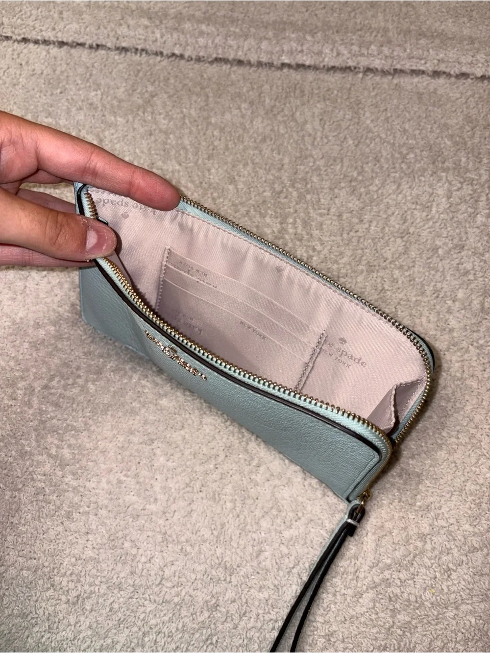 kate spade light blue pebbled leather wristlet phone case